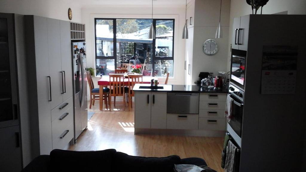 Open kitchen and dining area used for breakfast at Al and Rosies B+B