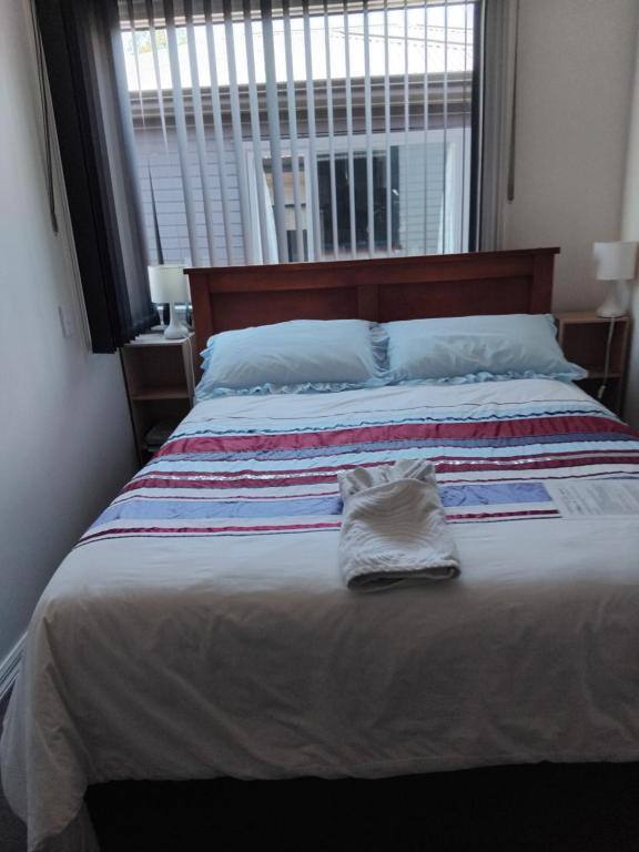 Double guest room with queen bed and window looking onto the garden